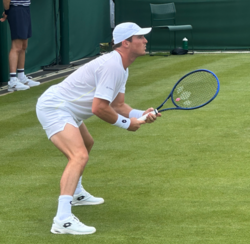 Tennis player with baseball cap