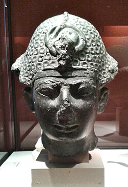 Thutmose IV wearing the khepresh, Musée du Louvre.