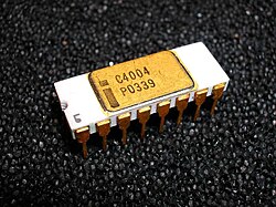 16-pin white ceramic DIP on black foam labeled with Intel logo and C4004