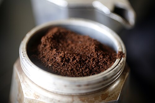 Funnel with ground coffee