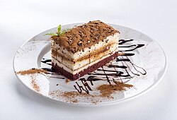 Rectangular piece of cake on a white plate