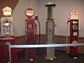 Four old-fashioned gasoline pumps at the 2012 Greater Milwaukee Auto Show.