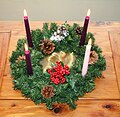 Advent wreath with three purple candles and one rose candle for Gaudete