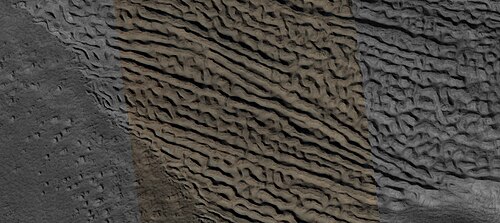 Close view of lineated valley fill (LVF) in valley, as seen by HiRISE under HiWish program. Linear valley flow is ice covered by debris. Lineated valley fill is generally considered to be and example of a glacier, as it involves the movement of ice.