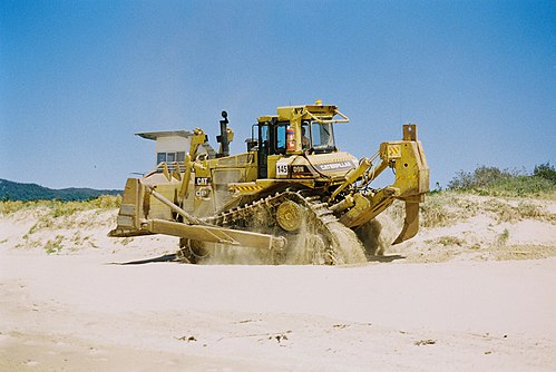 A Caterpillar D9N equipped with a single-shank ripper
