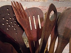 Wooden spoons and other utensils for frying.