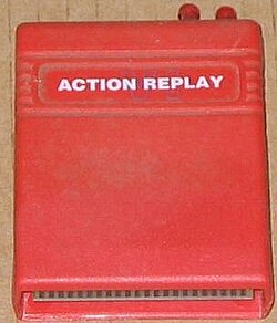A large square software cartridge in a red case.