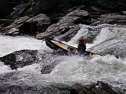 Marty Plante paddling a Mad River Outrage whitewater canoe on the Chattooga River.