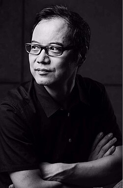 Black and white photographic portrait of Wang Chunchen