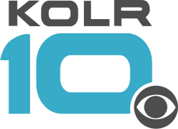 Gray wide letters KOLR above a teal, somewhat futuristic 10 with squarish sides. The CBS eye in gray overlaps the 0 in the lower right with a white cutout.