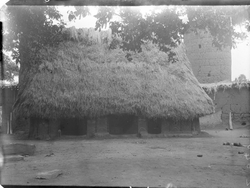 Igbo house with tower in the background