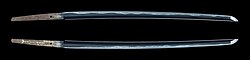 Katana forged by Nagasone Kotetsu. The letters inlaid with gold on the tang (nakago) indicated that Yamano Kauemon (山野加右衛門), the official executioner of the Tokugawa shogunate and examiner of sword cutting performance, cut the four human torso overlapped.[77]