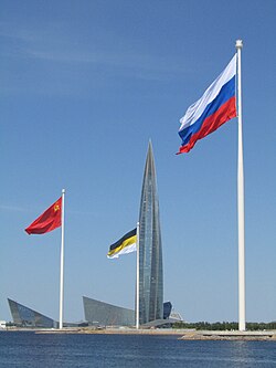 Display in Saint Petersburg in 2023, juxtaposing the white-blue-red tricolor with the prior black-yellow-white flag of the Russian Empire and the flag of the Soviet Union