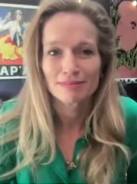 Photo of Alexis Bloom wearing a green shirt
