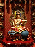Manjushri, seated on a blue lion at Buddha Tooth Relic Temple and Museum, Singapore
