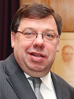 Cowen, 50, smiling in a photo