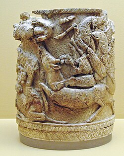 Ancient Greek ivory pyxis with griffins attacking stags. Late 15th century BC