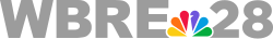 The letters "WBRE" and "28" in gray, slightly overlapped by the six-color NBC peacock