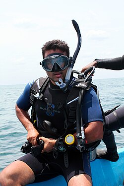 Diver wearing Scubapro dive suit and accessories
