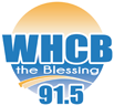 Orange sunrise and blue lettering reading "WHCB the Blessing 91.5"