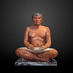 The Seated Scribe; 2613–2494 BC; painted limestone and inlaid quartz; height: 53.7 cm