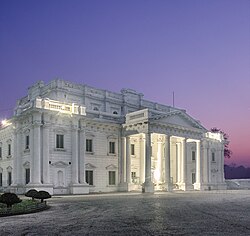 White-painted, colonnaded neoclassical façade of the library at dawn