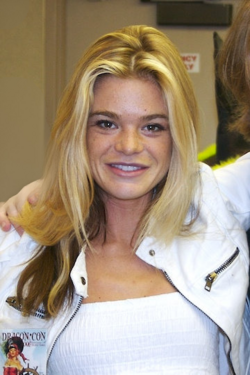 Headshot of actress Ellen Muth, looking to the right of the camera, with her blonde hair filling much of the image