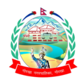 The seal features Prithvi Narayan Shah in the foreground with the outline Gorkha Palace in the background. There is also a balance scale near the outline of palace representing equality. The seal is surrounded by flag of Nepal in the top, two rhododendron flower on each side of the flag and a laurel on the left and right side. A red ribbon with the words Gorkha Municipality, Nepal in Nepali language is at the bottom.