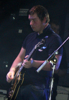 Nicholson performing with the Arctic Monkeys in 2006