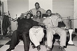 Left to right: Jean Baron, Aurlus Mabélé, Mav Cacharel; standing: Diblo Dibala.