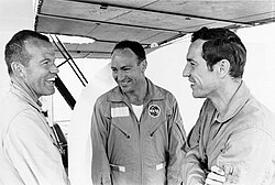 Standing around laughing in flight suits