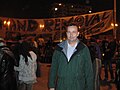 Man stood in front of banner