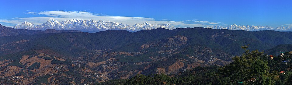 A panoramic view of the Garhwal and Kumaon Himalayas. Peaks rising above their surroundings are, among others, Trisul, Nanda Devi, the highest peak entirely within India's borders, and Nanda Kot. The Tibetan Plateau lies behind these mountains, as does the part of the Indus-Yarlung suture zone, the contour along which the Indian Plate has welded to the Eurasian plate. Mount Kailash and Lake Manasarovar in the Tibet Trans-Himalaya—sacred in Hindu and Buddhist mythology—lie immediately behind to the right. The Indus and Yarlung Tsangpo (the upper Brahmaputra river), which mark the western and eastern limits of the Himalaya range, rise near the lake.