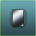 The 90 nm Cell/B.E. that shipped with the first PlayStation 3. It has its lid removed to show the size of the processor die underneath.