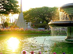 Fountain in Barão de Araras Square with the 100th Anniversary City Monument at the back