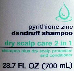 White shampoos label measuring 23.7 FL OZ (700 mL)