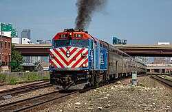 A Metra train departing Halsted Street station in July 2025