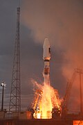Soyuz launch – a moment of support arms release. Lightning safety tower visible on a left.