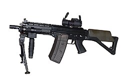 SG 552 Commando with an integral Picatinny rail and various accessories