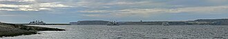 The whole path of the Gozo ferry, seen from Ramla Bay, Marfa. To the left Ċirkewwa terminal, to the right Mġarr harbour on Gozo
