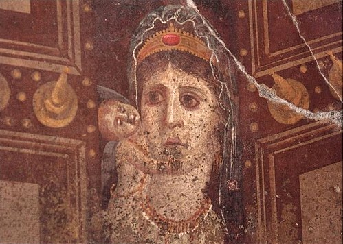 This mid-1st century AD Roman wall painting in Pompeii, Italy, showing Venus holding a cupid is most likely a depiction of Cleopatra VII of Ptolemaic Egypt as Venus Genetrix, with her son Caesarion as the cupid[25][26][27]