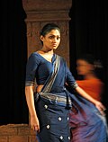 Sinhalese woman wearing a traditional Kandyan sari (osaria)