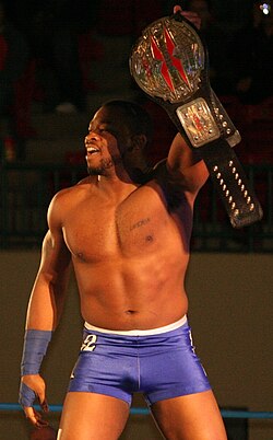 Kenny King with the 2nd design of the X-Division title.