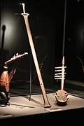 Center: six-string bowl zither (ligombo) of type B from the Nyamwezi in Central Tanzania. Missing gourd resonator.