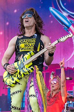 Satchel performing with Steel Panther in 2023