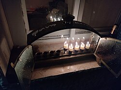 Hanukkiah next to the window