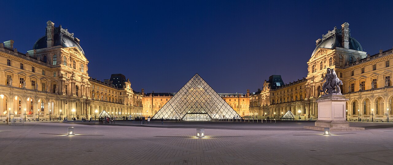 The Courtyard of the Louvre Museum at night