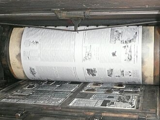 A Miehle flat-bed cylinder press in operation