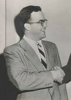 A black and white photograph of a man