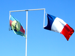 New Caledonia has two flags, flown here in Nouméa, the capital city, on a single flagpole with a crossbar